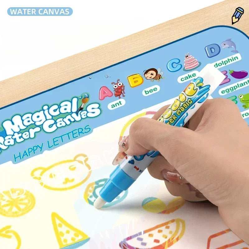A hand is using a magic pen to draw letters on a water canvas mat for kids.