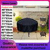 Black round fire pit cover displayed outdoors on a patio with various sized fire pits nearby.