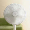A white dust cover for an electric fan is shown on a stand.