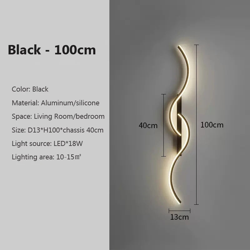 A black, curved LED wall lamp with a 100cm length mounted on a light gray wall.