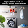 A laundry detergent cup holder with a drip tray is shown above a washing machine, with a hanger displaying a white towel.