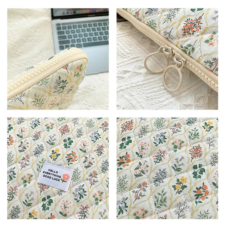 Floral printed fabric laptop sleeve featuring a zipper closure and decorative rings