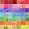 A grid of mixed colored acrylic beads in various sizes and styles for jewelry making