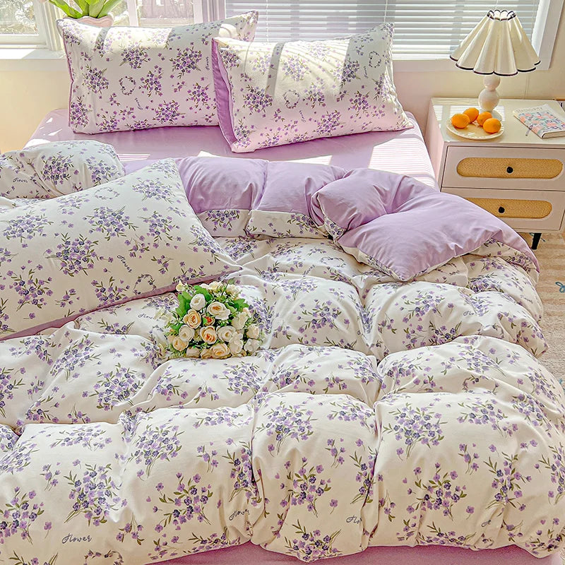Lavender floral duvet cover set with matching pillowcases featuring purple and white floral patterns.