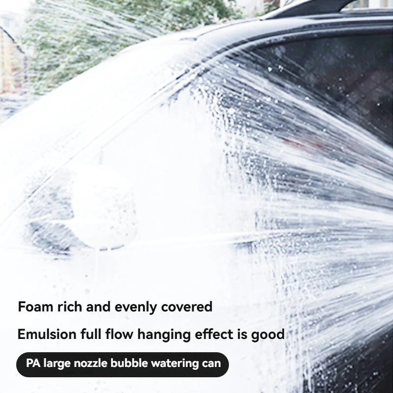 Close-up of a car being washed with foam from a high-pressure foam cannon