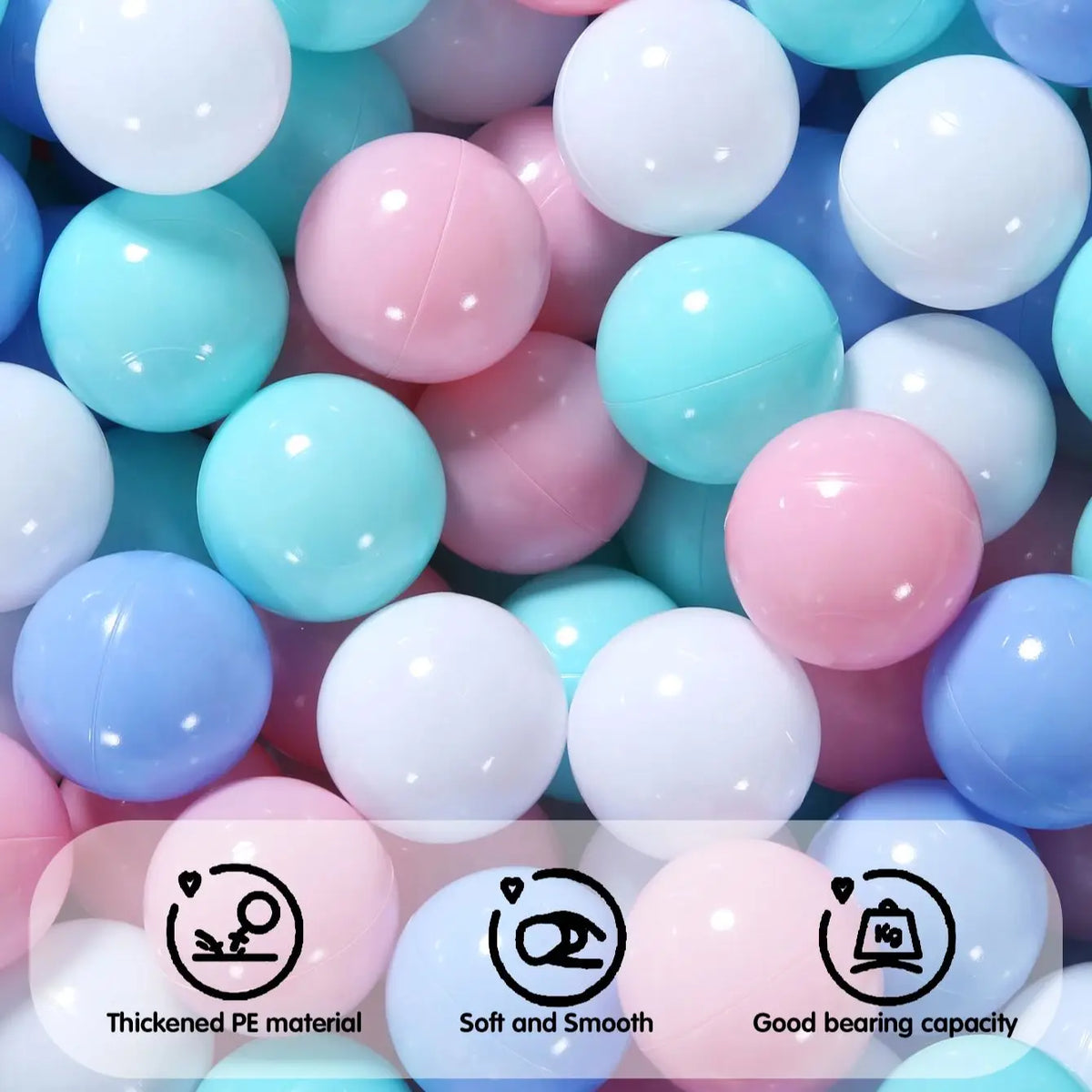 A close-up view of a variety of colorful, smooth ball pit balls in shades of pink, blue, and white.