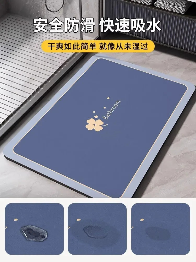 A blue non-slip bathroom mat with a floral design is shown next to a shower or tub.