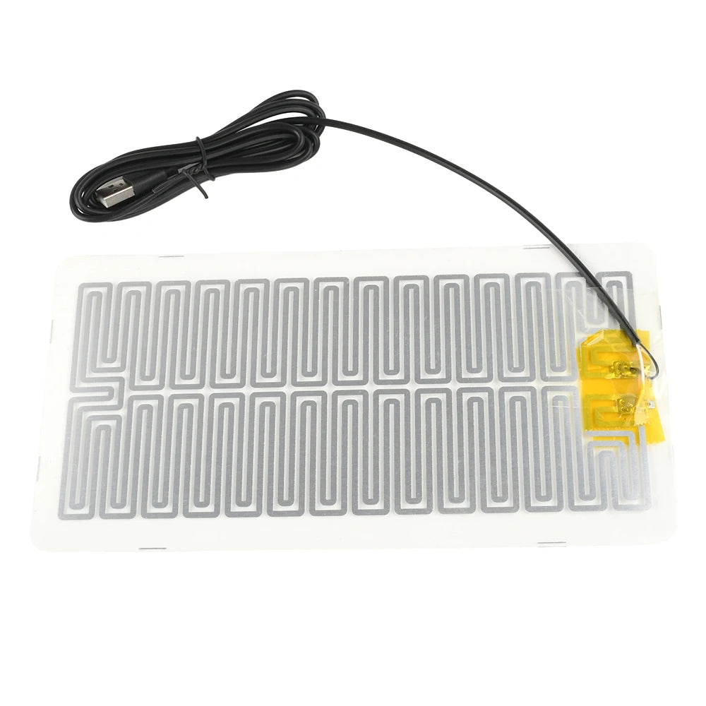 A black cord connects a 5V USB waterproof heating pad for desk and plant warmth.