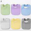 A set of six cotton bandana bibs in pastel colors including green, purple, blue, white, yellow, and gray.