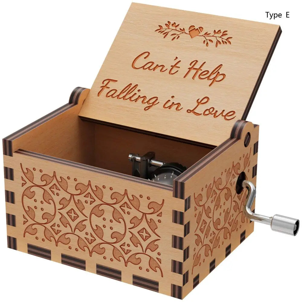 A wooden music box with a lid featuring the title Can't Help Falling in Love and decorative patterns.