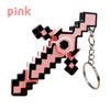 Pink transformable gemstone toy keychain with a black and pink checkered design.
