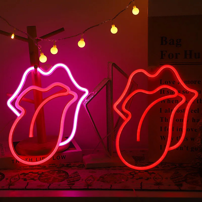 Pink LED lip neon sign shaped like lips with a cross and decorative lights
