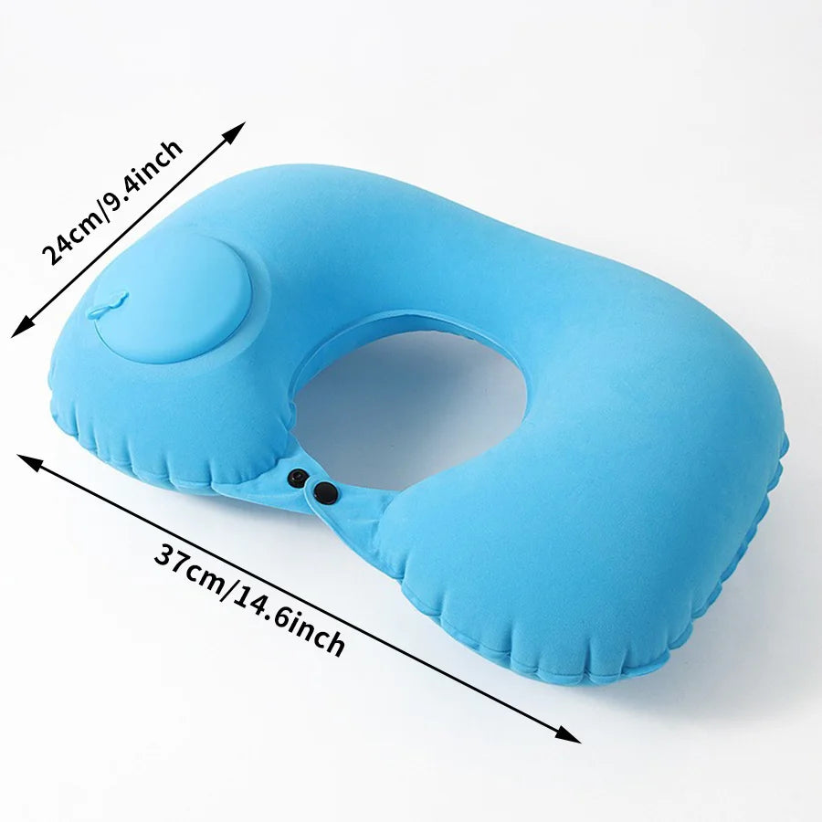 Light blue self-inflating travel neck pillow with a soft flocking cover shown from above.