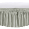 A light beige adjustable wrap-around bed skirt with elegant ruffles.