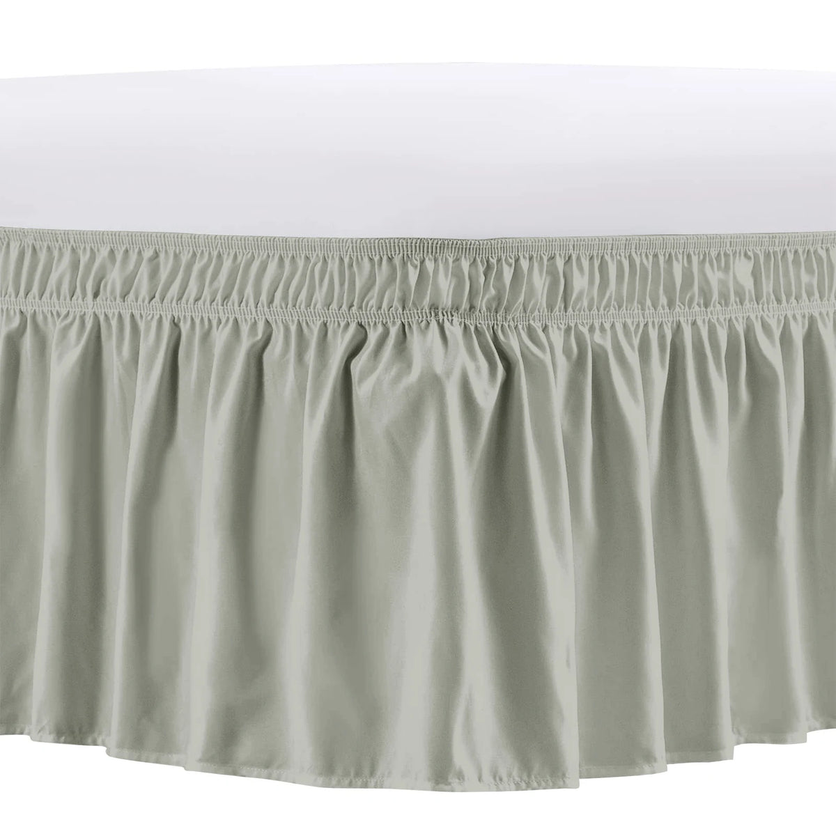 A light beige adjustable wrap-around bed skirt with elegant ruffles.