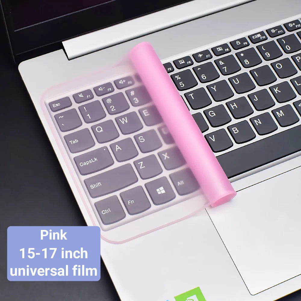 Pink universal film keyboard cover for a laptop showing the silicone skin on the keys