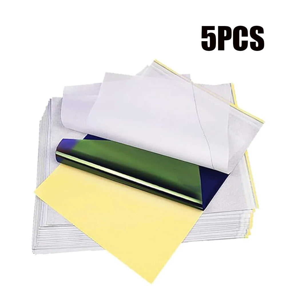 A pack of five tattoo practice skin and thermal transfer paper sheets in various colors stacked on a white background.