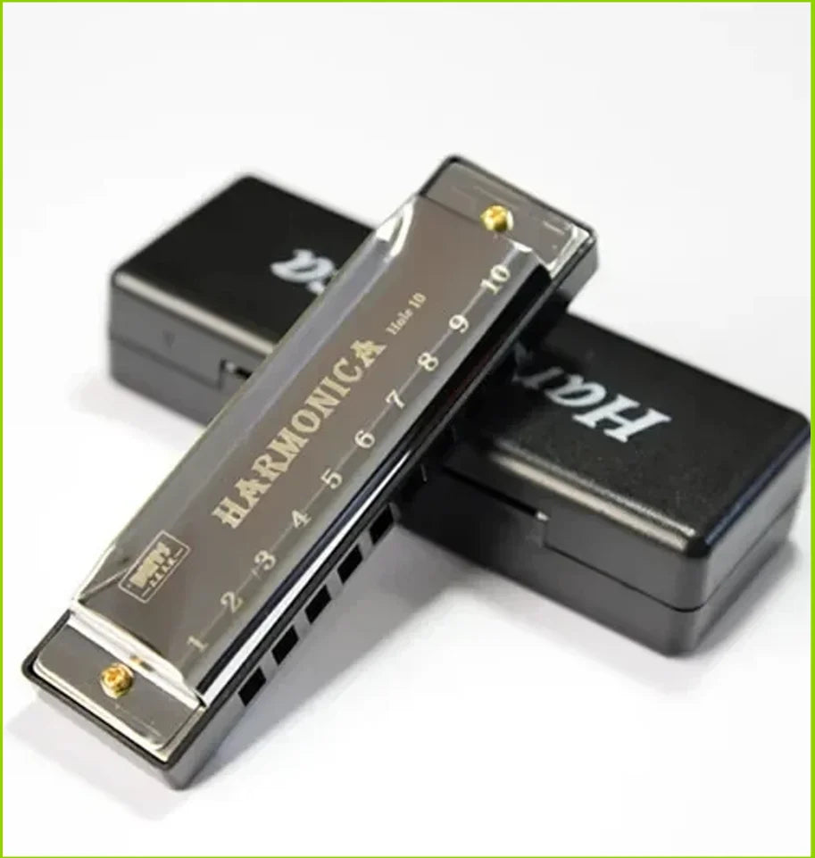 A harmonica is shown inside its protective case, featuring a 10-hole diatonic design.