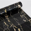 Black marble wall sticker with gold veining, rolled up for display.
