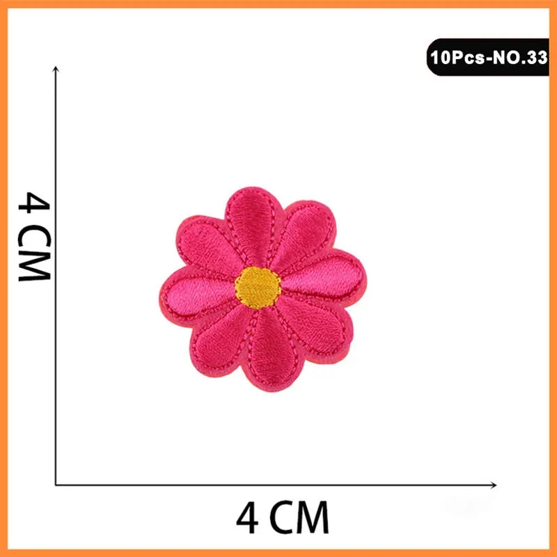 Pink embroidered rose iron-on patch with a yellow center