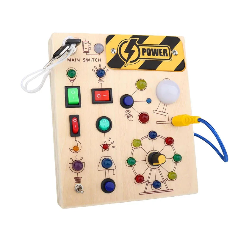 A wooden busy board with various switches, lights, and sensory components for toddlers.