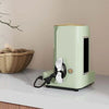 A light green cord organizer and wire winder device with a black cable is shown on a white surface.