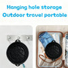 Black foldable silicone ice bath and facial massage bowl shown in an outdoor travel context.