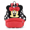 A black and white Minnie Mouse themed backpack with a red bow and cow print fabric.