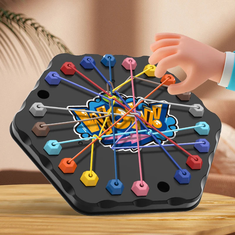 A hand is placing colorful rope puzzle pieces onto a black board to untangle them.