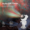 An astronaut night light with a remote control and timer is shown illuminating a person sleeping.