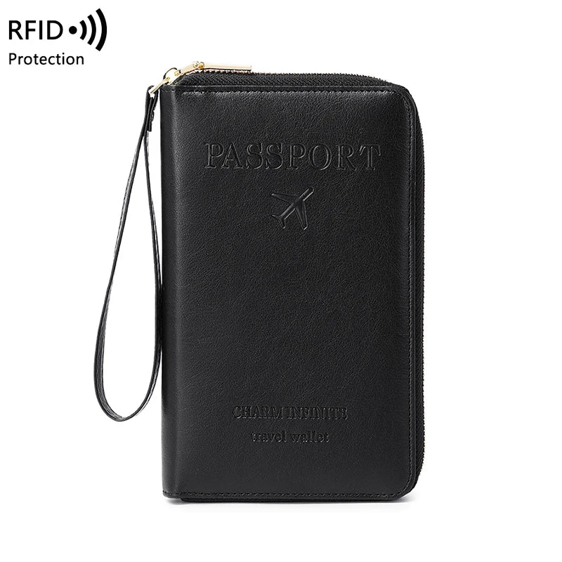 Black passport RFID blocking travel wallet with a gold-colored wrist strap