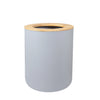 A cylindrical bathroom organizer set made of light gray ceramic with a bamboo lid and dispenser top.
