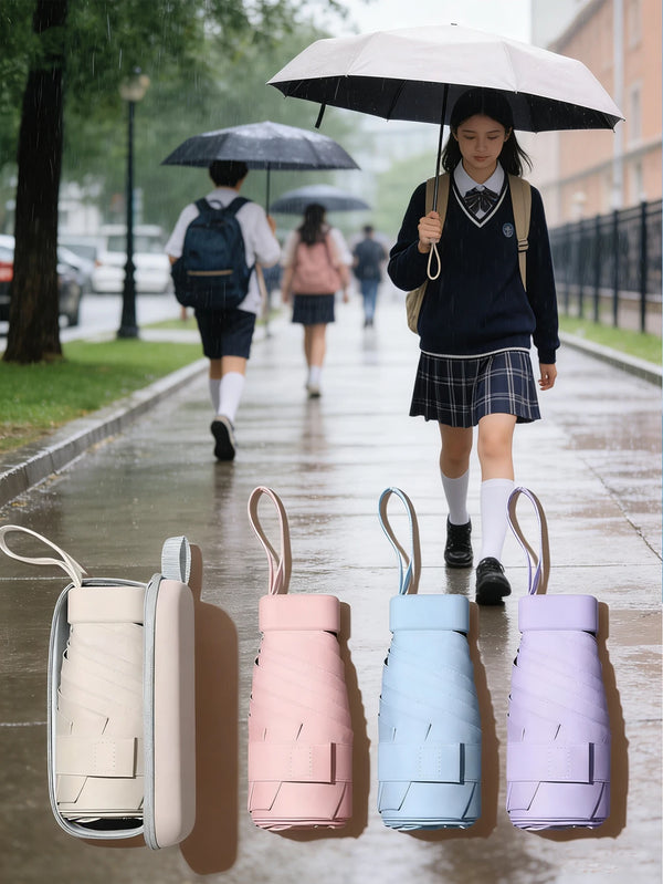 A collection of five ultra-compact 5-fold umbrellas in various pastel colors displayed on a surface.