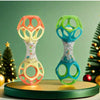 A pair of colorful baby rattle toys with soft teether beads in orange and green on a wooden base.