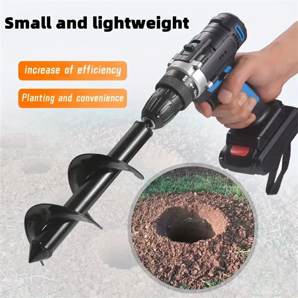 A hand is operating a black garden auger drill bit in the soil to create a planting hole.