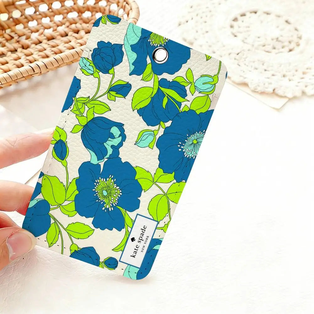 A teal and lime green floral pattern card holder featuring blue flowers on a light background.