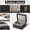 A black box made of carbon fiber fabric with gold-tone hardware, showing details of its texture and layered shielding.