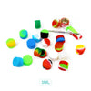 A collection of colorful silicone travel jars in various shades including green, blue, yellow, and red, shown next to a metal