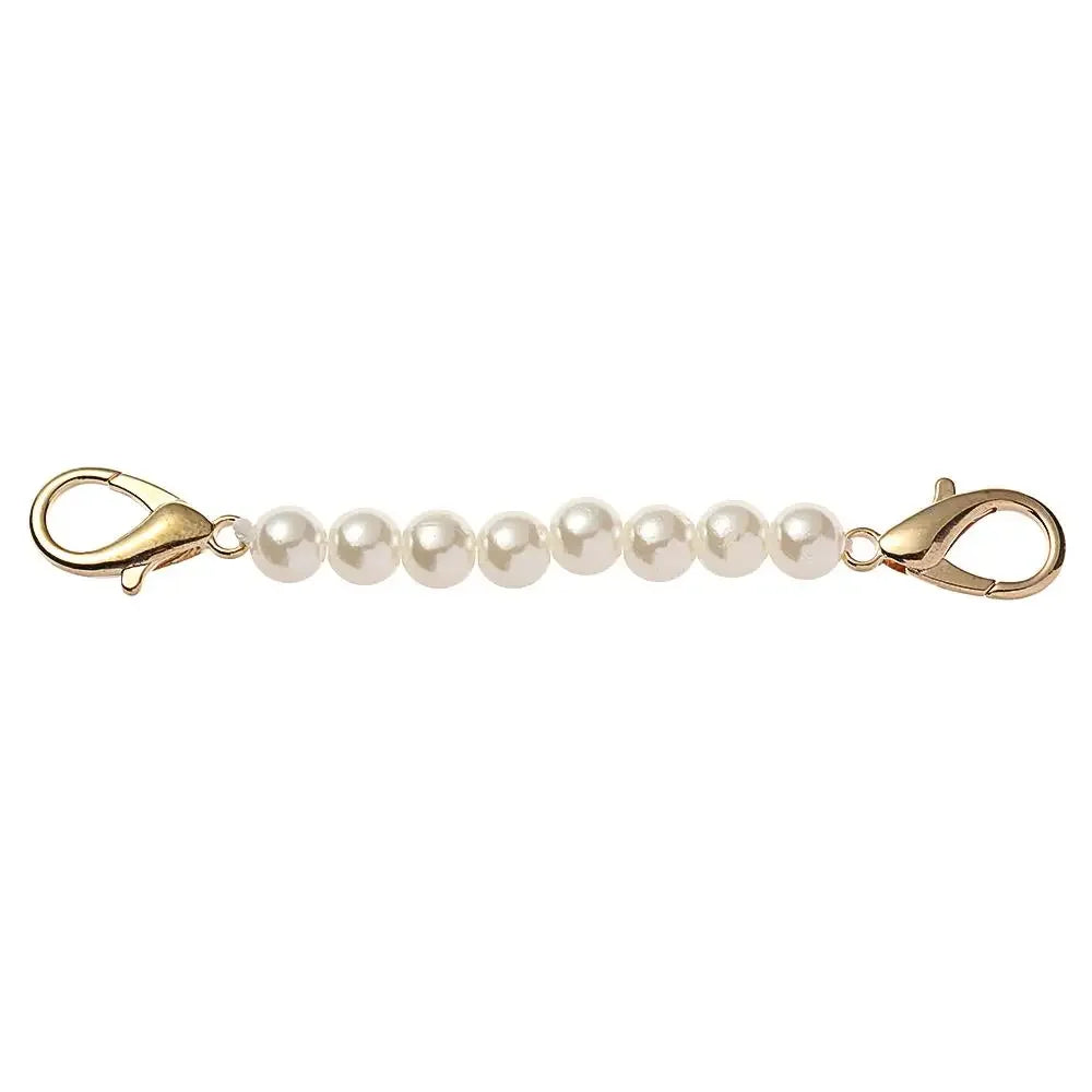 Gold-toned pearl strap replacement for handbags with a hinged clasp.