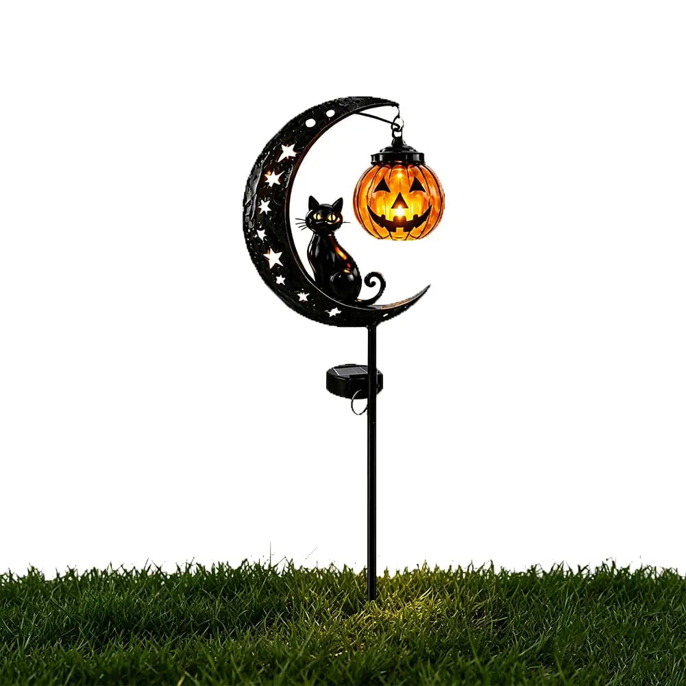 A black cat silhouette and a carved pumpkin are mounted on a stake light shaped like a crescent moon for Halloween decoration