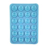 A silicone suction cup phone mount with multiple holes for hands-free viewing.