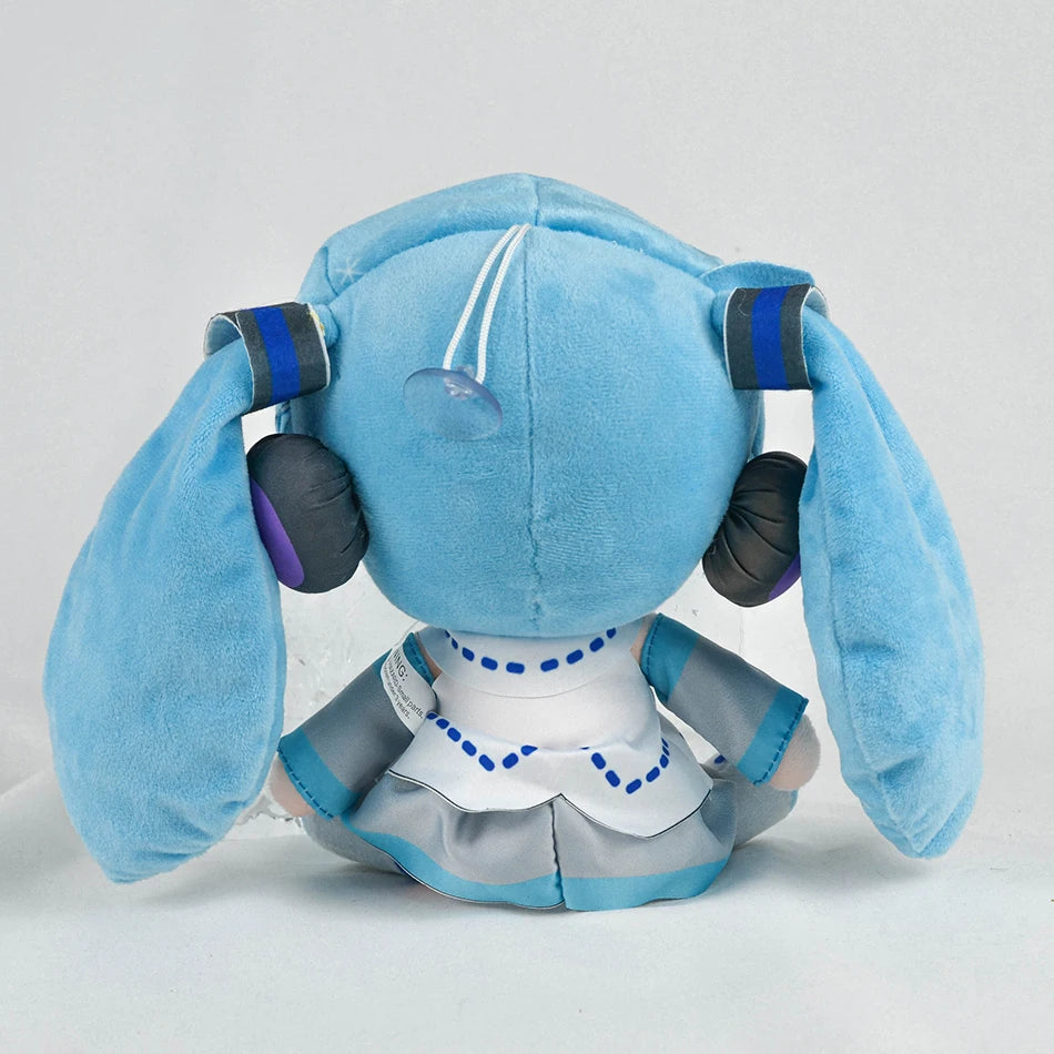 A soft blue Hatsune Miku plush doll with large ears and a white collar.