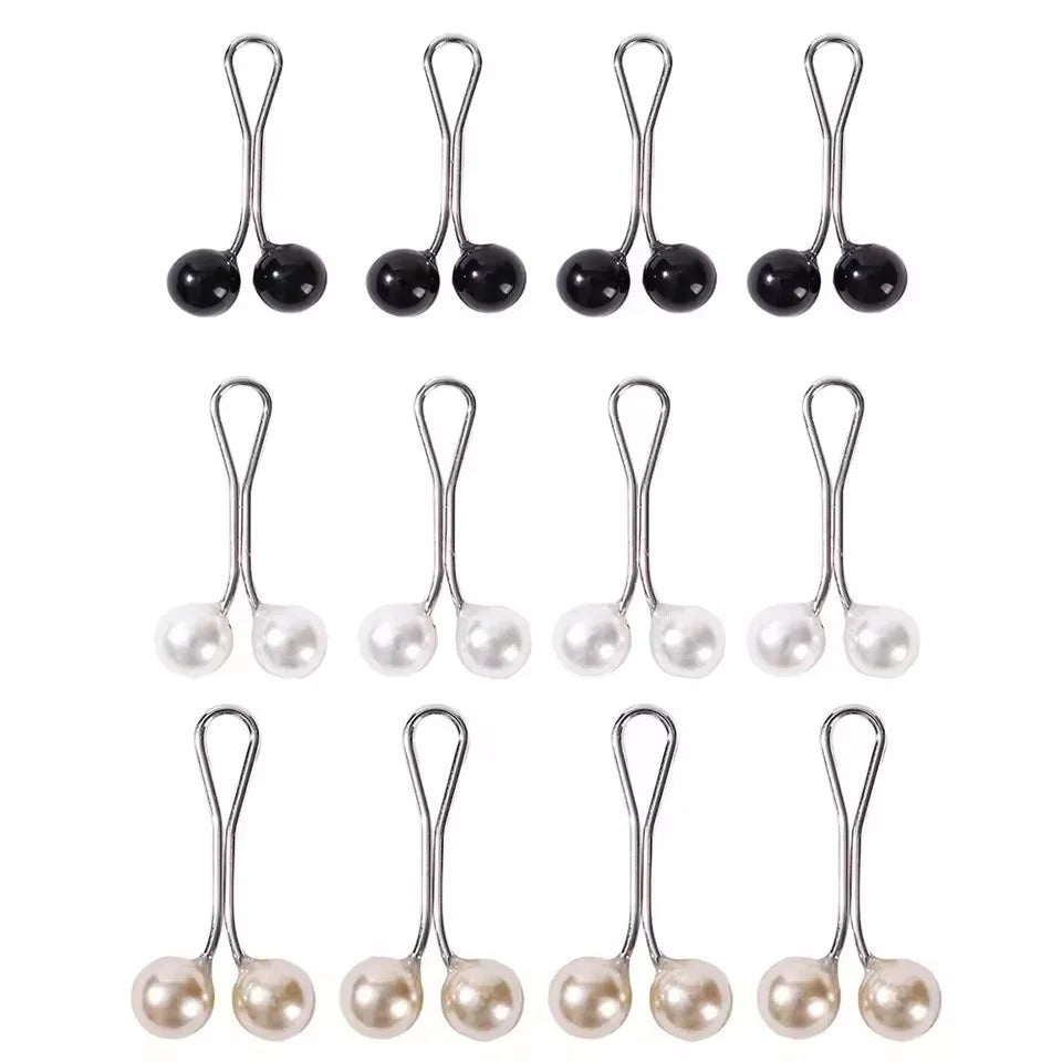 A set of twelve silver pearl hijab pins displayed individually.