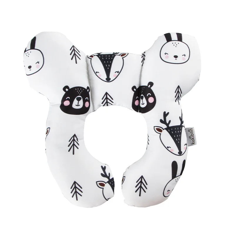 A white plush pillow shaped like various animal heads for baby head and neck support.
