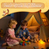 A child is playing with a squishy fox night light product on a wooden floor inside a tent.
