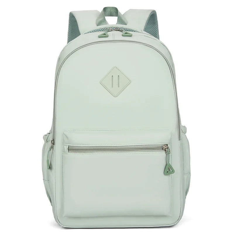 A light mint green urban nylon backpack with a gray strap and diamond-shaped logo.
