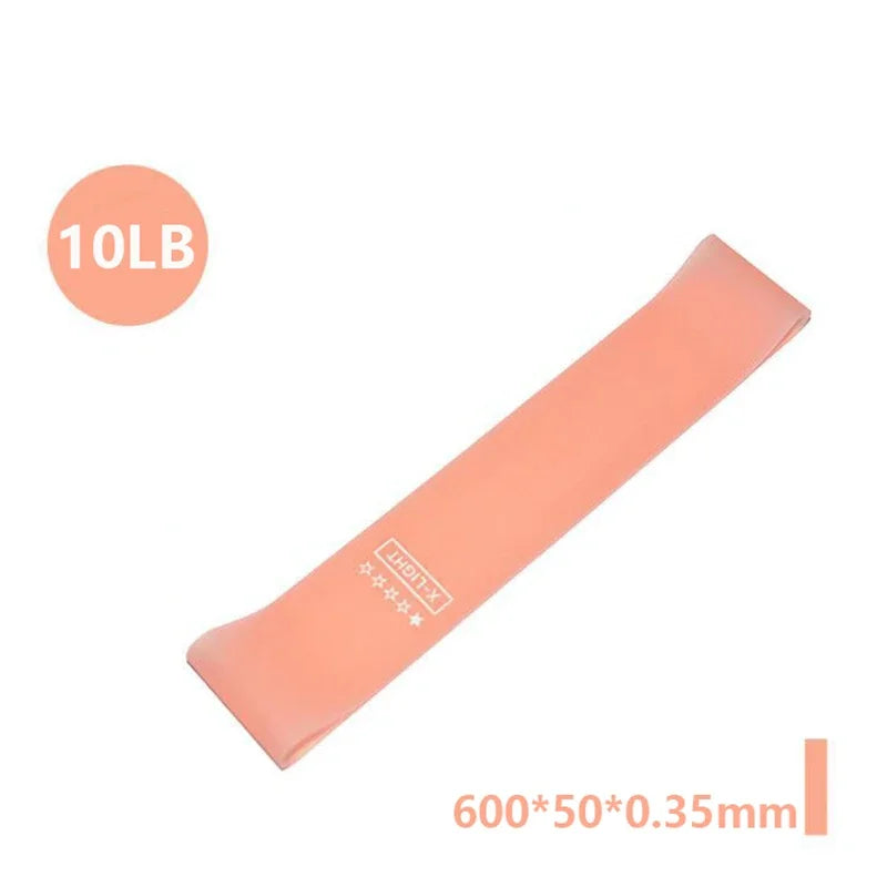 A pink resistance band labeled 10LB, measuring 600x50x0.35mm.