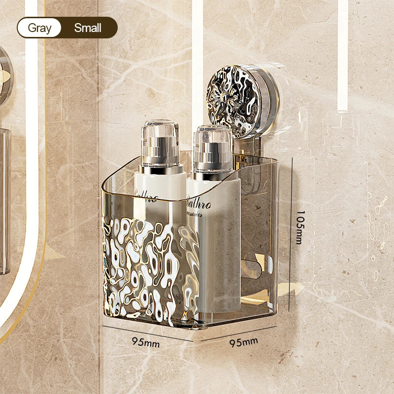 A silver wall-mounted suction cup storage basket with a water ripple design and an attached glass bottle.