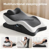 A multifunctional memory foam sleeping pillow in black and white rests on a bed, shown from multiple angles.