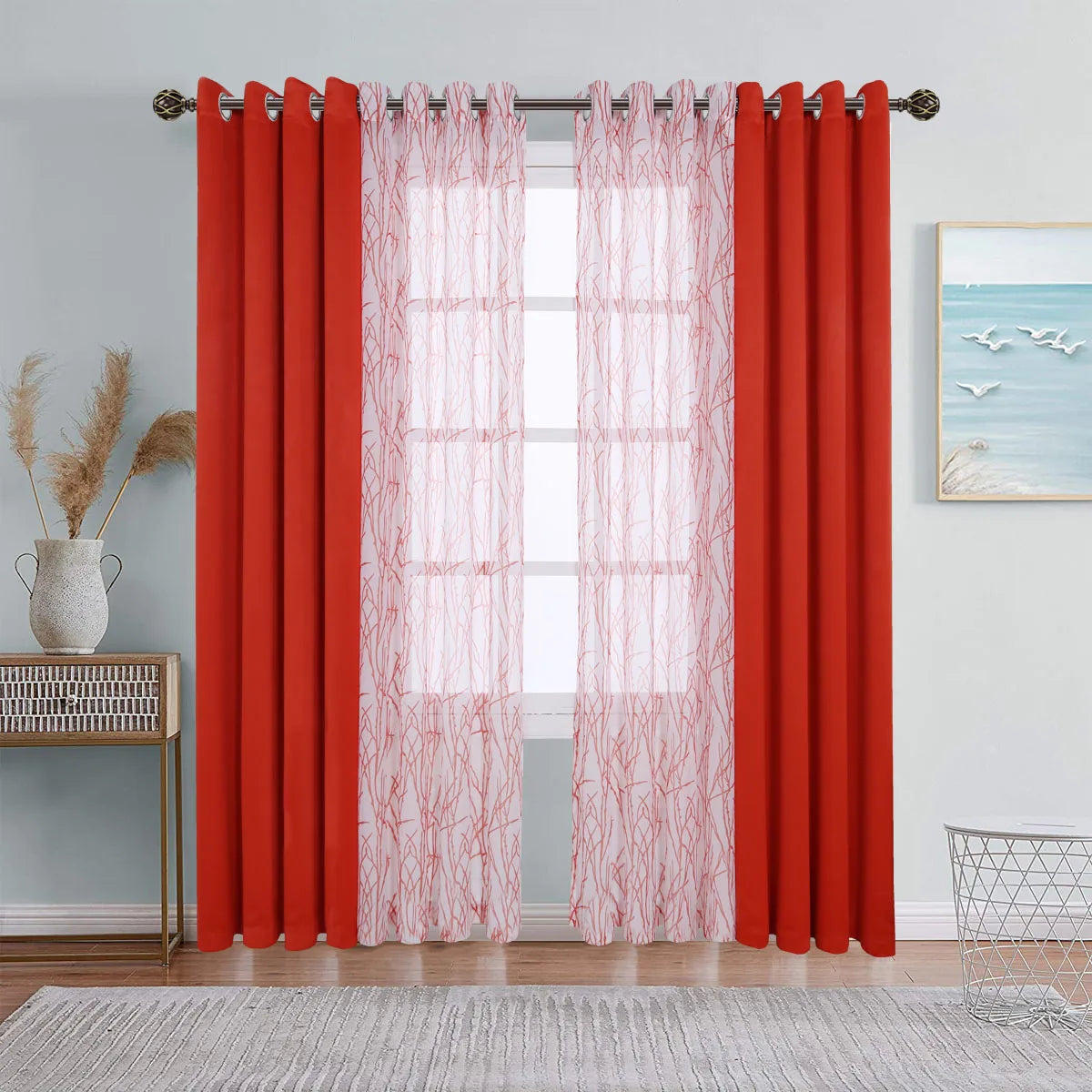 A set of dual layer window curtains featuring solid orange-red blackout panels and sheer pink curtains hanging on a rod.